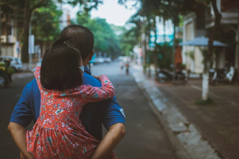 a man and a woman walking down a street, pexels contest winner, sweet hugs, mai anh tran, square, panoramic view of girl