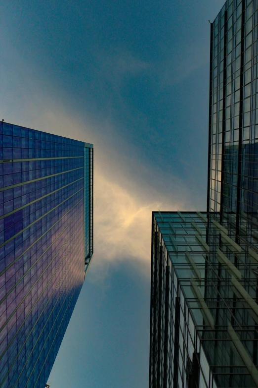 a couple of tall buildings next to each other, a picture, by David Donaldson, pexels contest winner, glass ceilings, large sky, square, postprocessed)