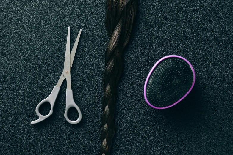 a pair of scissors and a hair brush on a table, a portrait, by Adam Marczyński, trending on pexels, plasticien, long braided purple hair, icon style, carbon fibers