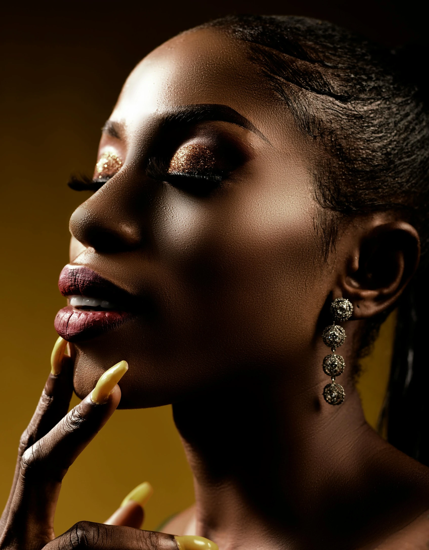 a woman with her hand on her face, inspired by Hedi Xandt, trending on pexels, afrofuturism, brown and gold color palette, shiny skin”, ( ( dark skin ) ), lights on