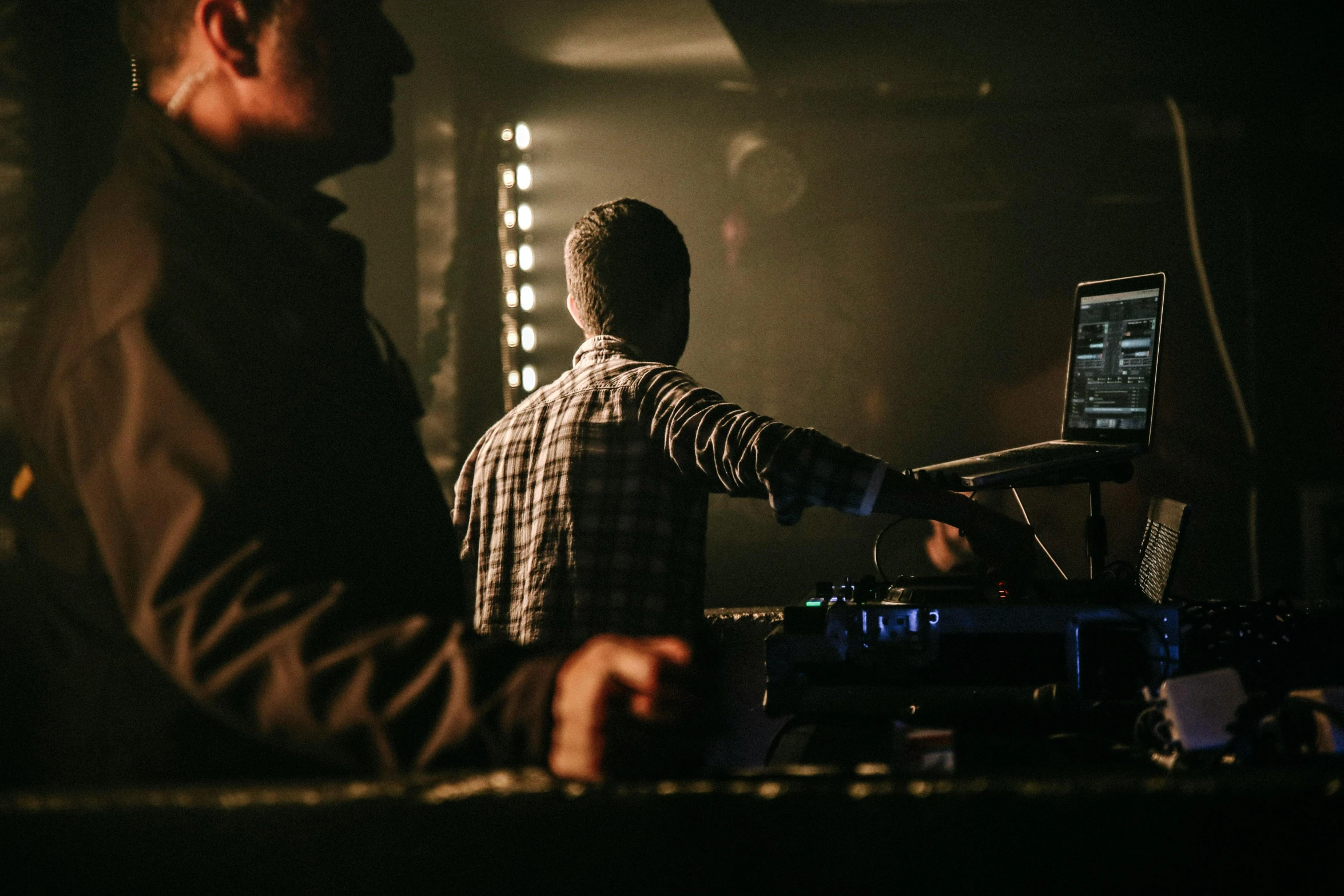 two men standing next to each other in front of a computer, by Niko Henrichon, unsplash, happening, stage at a club, mixing, 15081959 21121991 01012000 4k, bottom angle