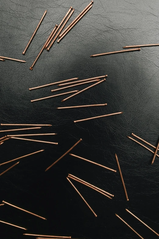 a bunch of needles sitting on top of a table, copper, thumbnail, overview, rectangular