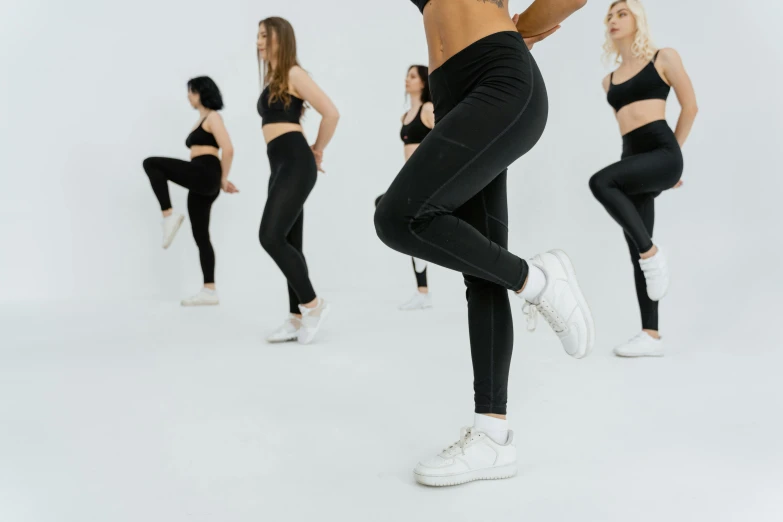 a group of women dancing in a dance studio, trending on pexels, black leggins, in front of white back drop, sneaker, animation