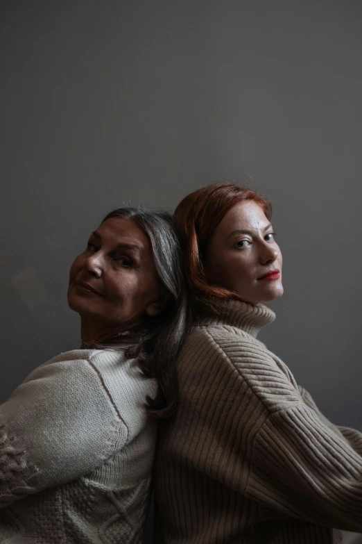 a couple of women standing next to each other, a portrait, trending on pexels, antipodeans, silver and muted colors, ( redhead, ayanamikodon and irakli nadar, wrinkles