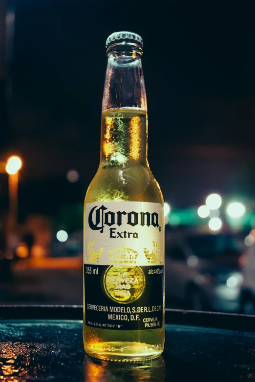 a bottle of corona extra sitting on top of a table, by Carey Morris, pexels contest winner, street night, on a parking lot, thumbnail, mexican