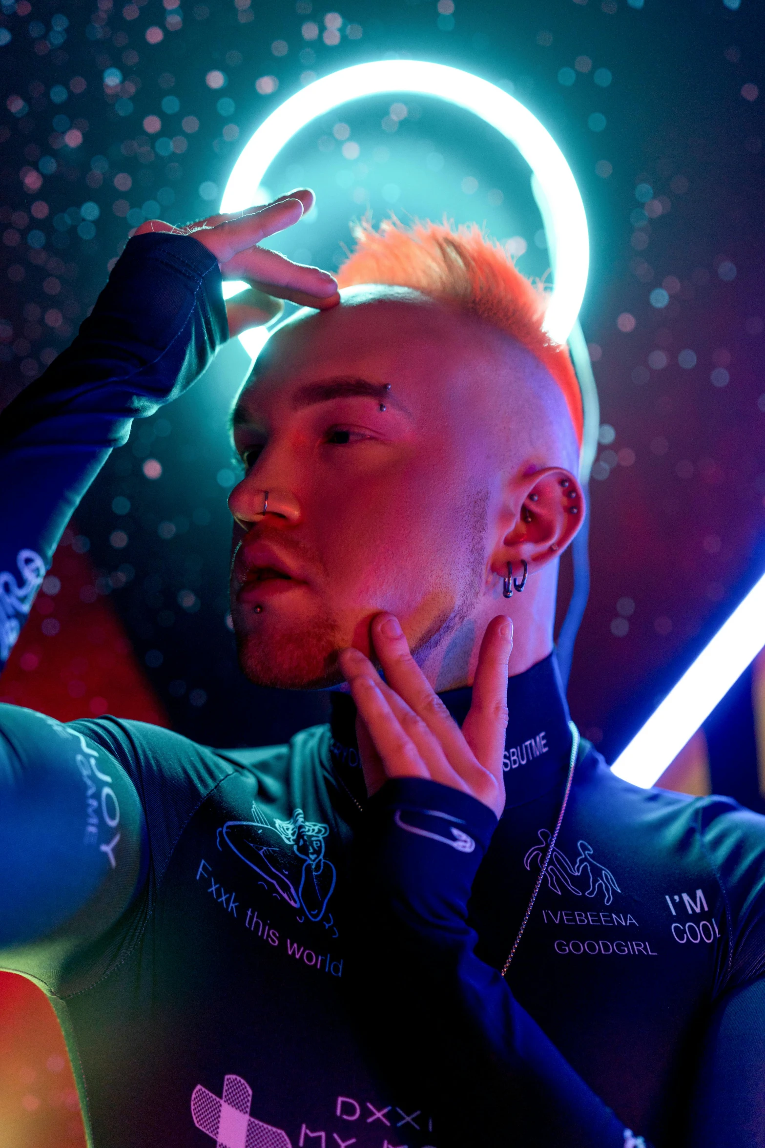 a man standing in front of a neon light, inspired by David LaChapelle, trending on pexels, rococo, hairstyle red mohawk, cai xukun, standing in a starbase bar, bald on top