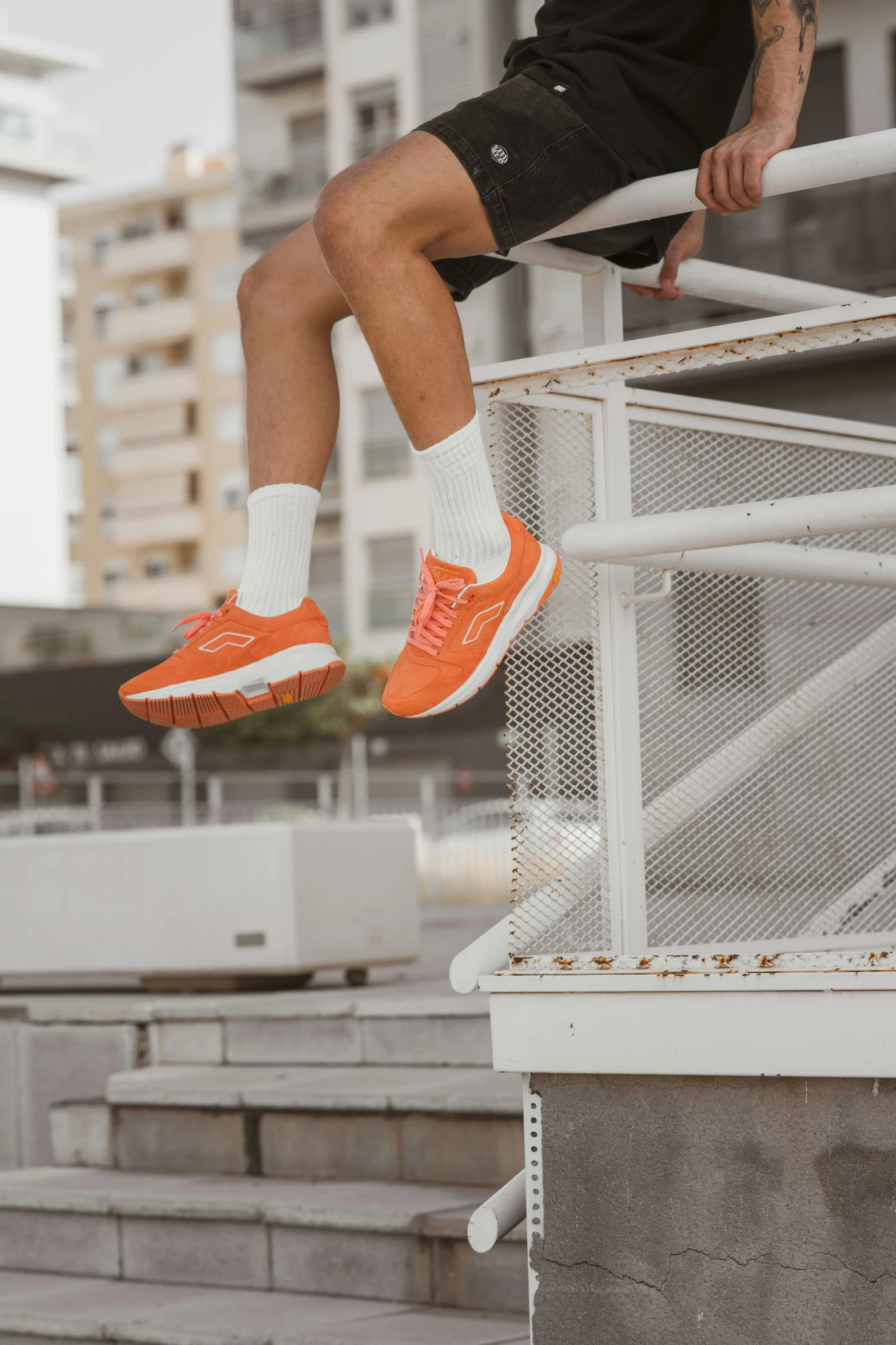 a man flying through the air while riding a skateboard, by Jacob Pynas, pexels contest winner, orange and white color scheme, running shoes, sits on a rooftop, coral