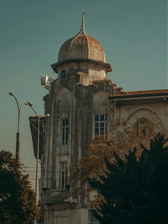 a large building with a clock tower on top of it, an album cover, unsplash contest winner, ottoman sultan, 2 0 0 0's photo, exterior view, trending on vsco