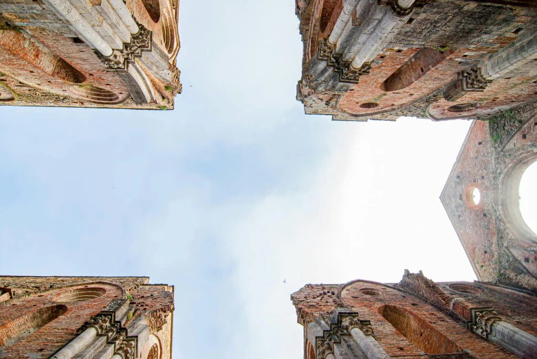 a view from the ground looking up at the sky, an album cover, inspired by Hubert Robert, pexels contest winner, romanesque, rusty metal towers, ruined medieval architecture, unsplash 4k, high view