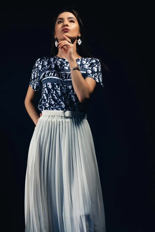 a woman in a blue top and white skirt, trending on unsplash, dior campaign, 15081959 21121991 01012000 4k, wearing a t-shirt, studio shot in style