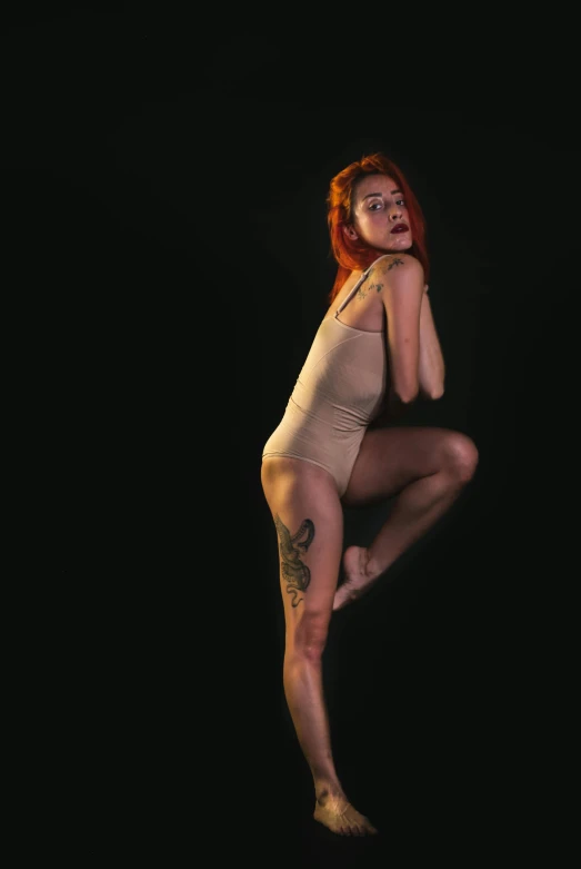 a woman that is standing up in the air, an album cover, inspired by Elizabeth Polunin, unsplash, non binary model, leeloo, high quality photo, thin bodysuit