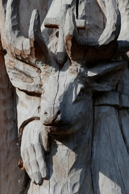 a close up of a wooden statue of a person, big horns, treant, wooden buildings, intricate image