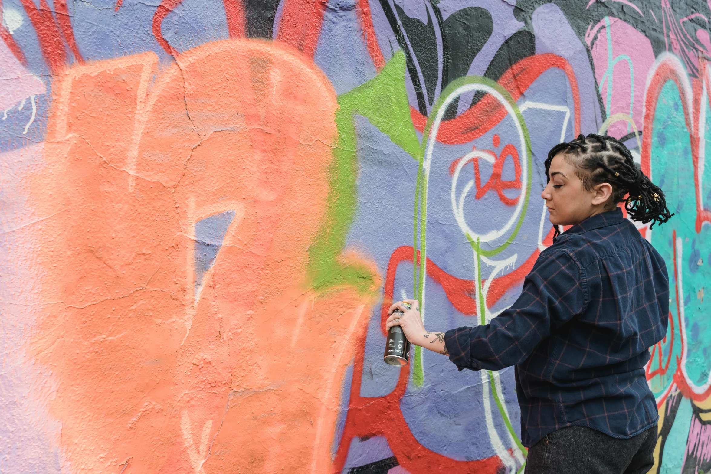 a woman spray painting graffiti on a wall, promo image, thumbnail, mirka andolfo, twice