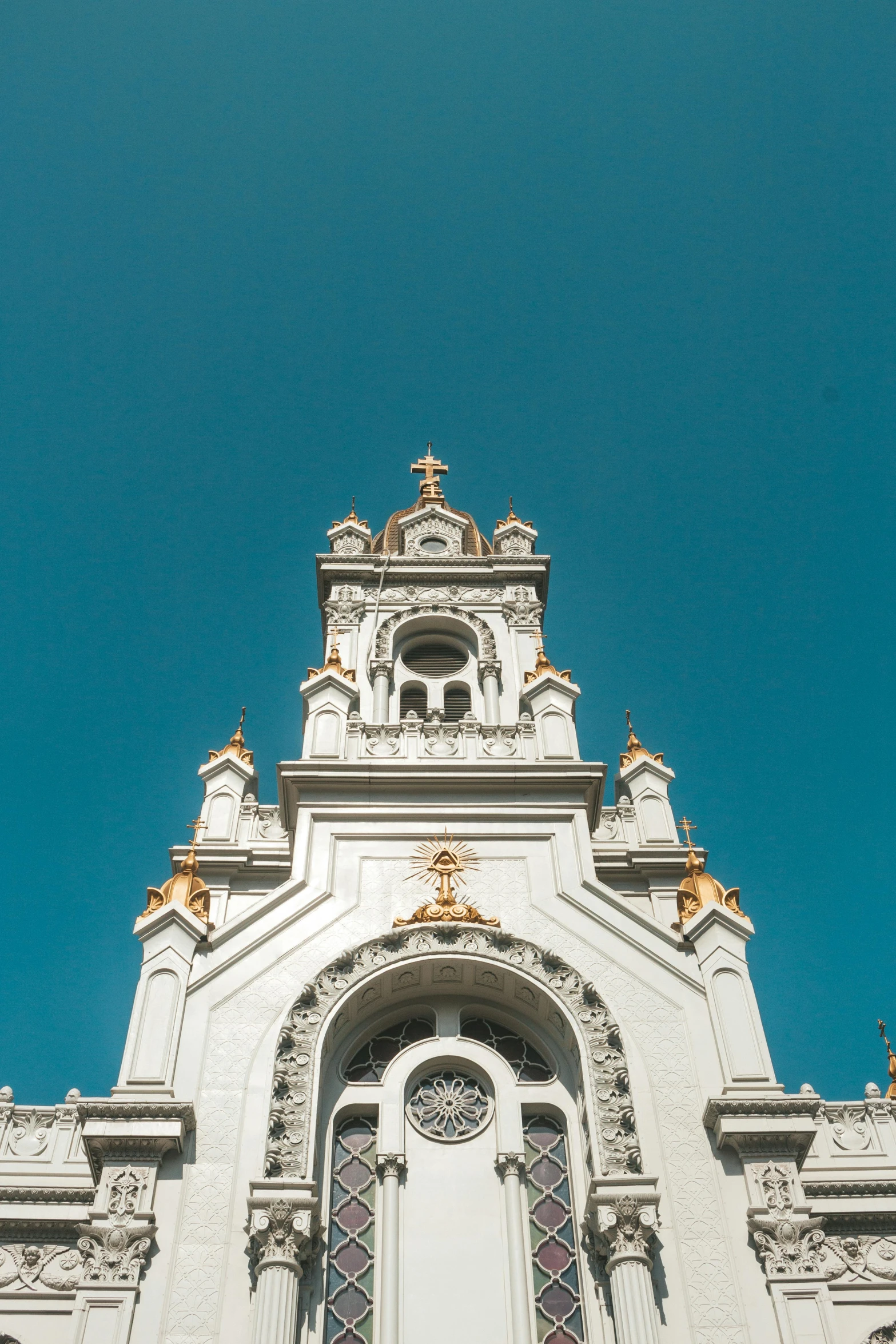 a tall white building with a clock tower, an album cover, unsplash contest winner, baroque, beautiful gold saint, buenos aires, indian temple, 2019 trending photo