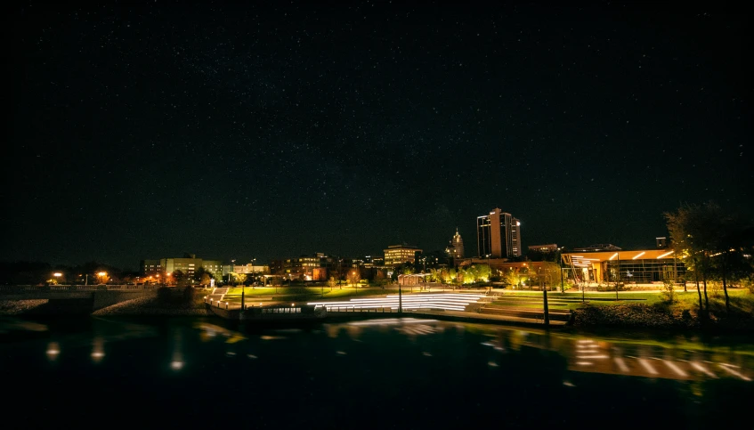 a view of a city at night from a bridge, pexels contest winner, hurufiyya, stars and paisley filled sky, cornell, lightshow, “wide shot