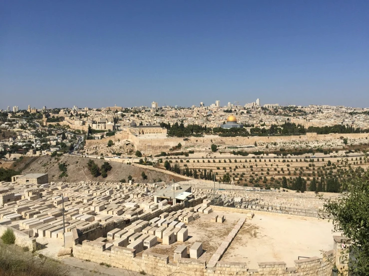 a view of a city from the top of a hill, inside the tomb of jesus, family friendly, award - winning, carson ellis