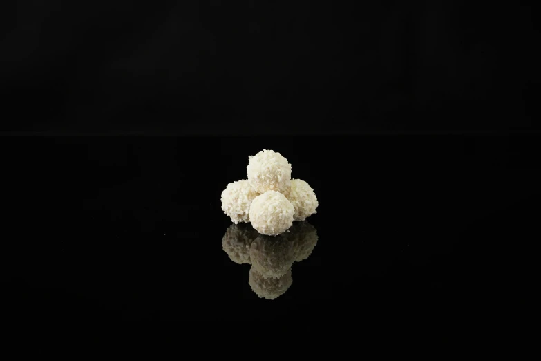 a pile of cauliflower sitting on top of a black surface, by Jay Hambidge, hurufiyya, balls of rice, miniature product photo, sweets, three views