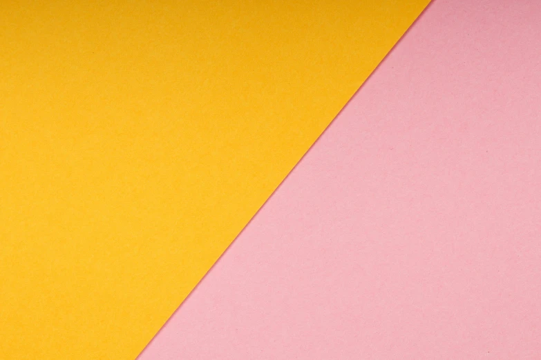 a pair of scissors sitting on top of a pink and yellow piece of paper, inspired by Malevich, unsplash, depth detail, diagonal, 2 colours, colors: yellow