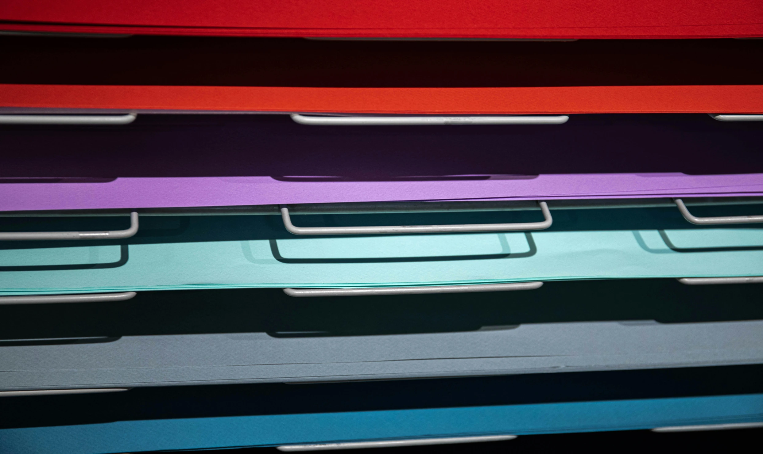 a bunch of folders stacked on top of each other, inspired by Donald Judd, unsplash, color field, metal handles, mauve and cinnabar and cyan, textured plastic, bottom body close up