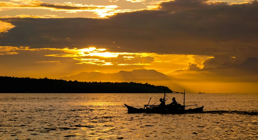 a couple of people that are on a boat in the water, inspired by Fernando Amorsolo, pexels contest winner, sumatraism, sunset panorama, thumbnail, fishing village, late afternoon sun