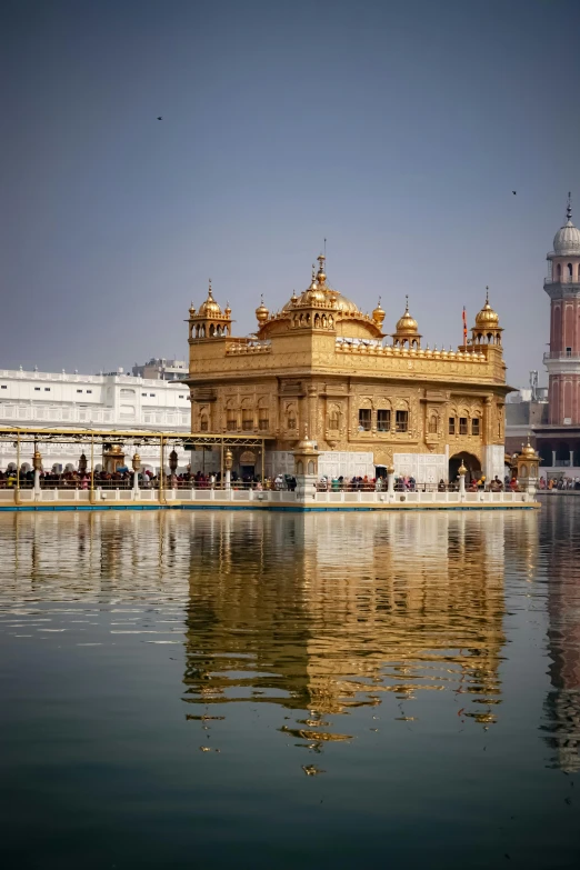 the golden temple is reflected in the water, a picture, by Manjit Bawa, pexels contest winner, renaissance, square, panoramic, professionally color graded, high resolution photograph