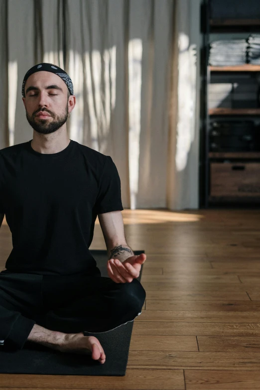 a man sitting in the middle of a yoga pose, trending on pexels, renaissance, lgbtq, centered in portrait, ethan klein, meditating