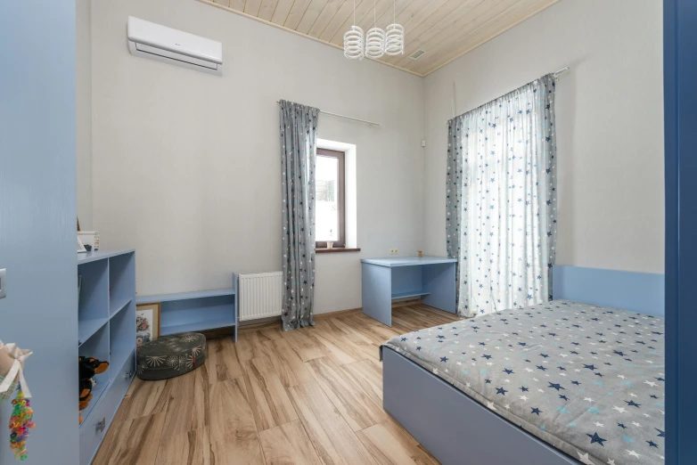 a bed sitting in a bedroom next to a window, inspired by Avgust Černigoj, trending on reddit, light and space, soft grey and blue natural light, simple ceiling, for kids, high quality photo