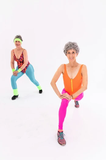 a couple of women standing next to each other, an album cover, by Pamela Drew, wearing fitness gear, costumes, she is about 7 0 years old, high key