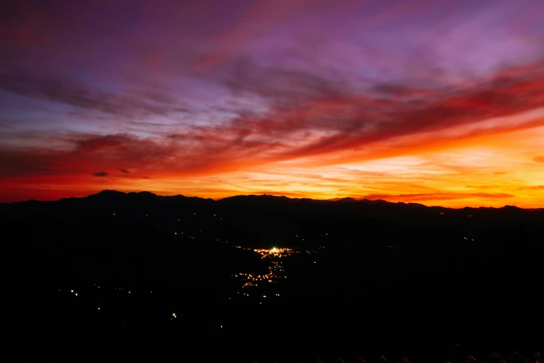 a view of a sunset from the top of a hill, by Meredith Dillman, pexels contest winner, happening, night colors, 120 degree view, multiple stories, mountain sunrise