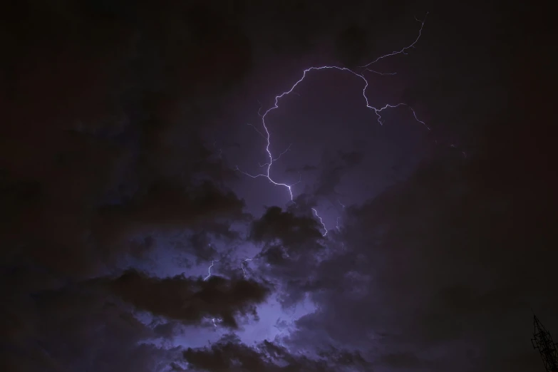 a lightning bolt hitting through a cloudy sky, by Daniel Seghers, pexels contest winner, hurufiyya, ☁🌪🌙👩🏾, blue and purple lighting, rembrandt lightning, low angle 8k hd nature photo