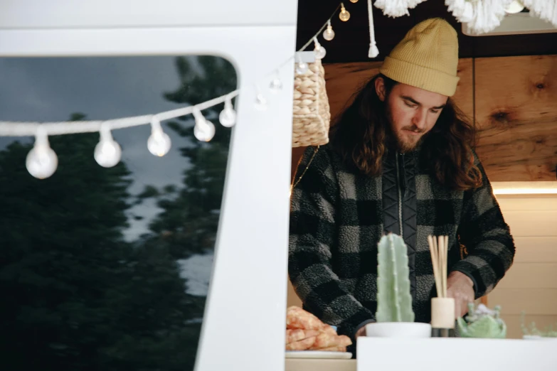 a man standing in front of a food truck, trending on unsplash, cottagecore hippie, aussie baristas, avatar image, canopies