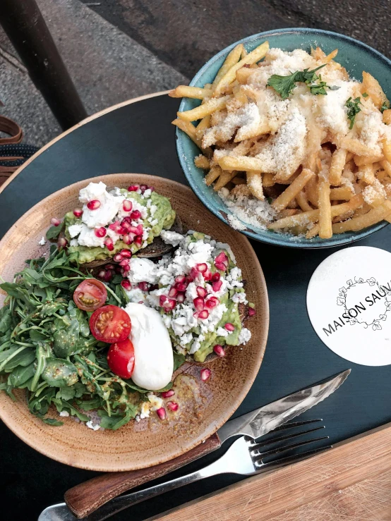 a close up of a plate of food on a table, by Morgan Russell, instagram, with fries, manuka, mamou - mani, hasbulla