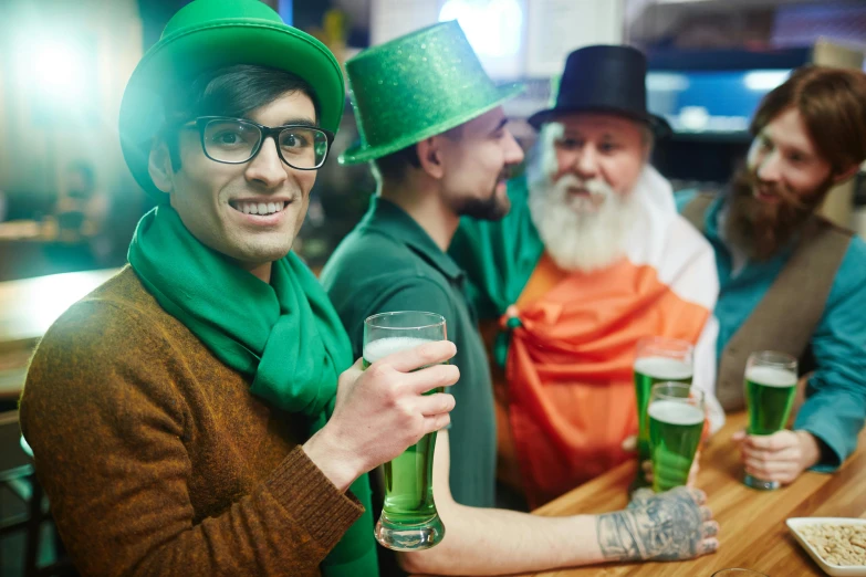 a group of men sitting at a bar drinking beer, a photo, by Adam Marczyński, shutterstock, renaissance, wearing green tophat, four leaf clover, wearing hi vis clothing, avatar image