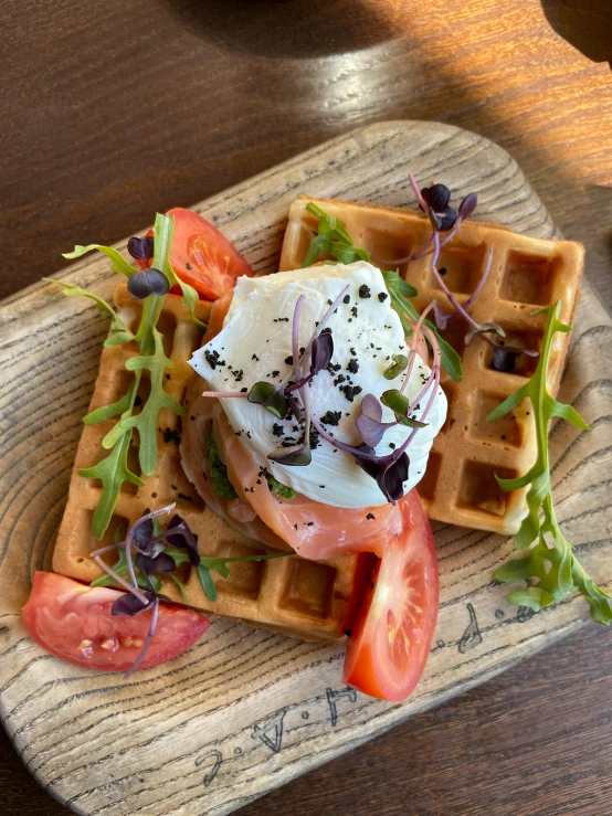 a waffle sitting on top of a wooden cutting board, offering a plate of food, thumbnail, rafeal albuquerque, profile image