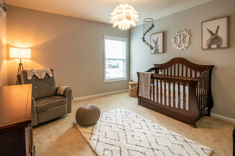 a baby's room with a crib and a chair, inspired by William Home Lizars, unsplash contest winner, listing image, carpeted floor, real estate photography, multiple lights