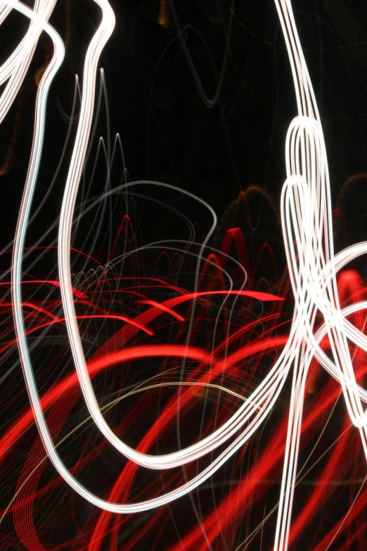 a long exposure photograph of red and white lights, an abstract drawing, dramatic lighting - n 9, scribbles, up-close, tall