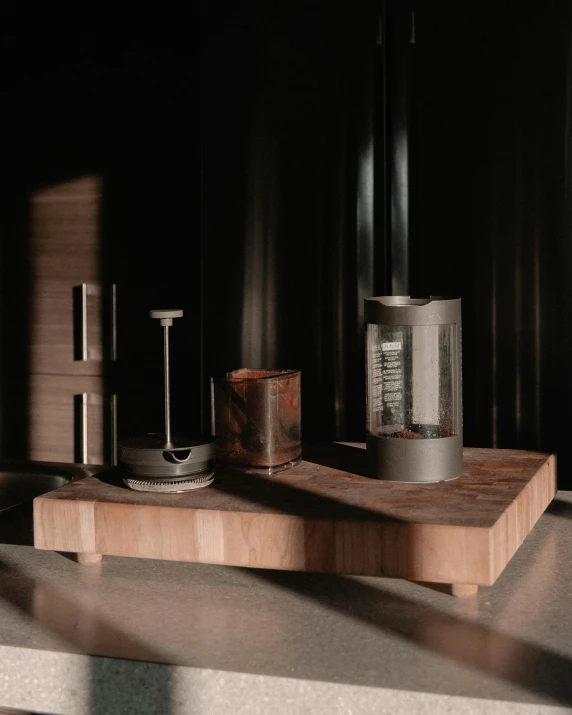 a coffee maker sitting on top of a counter, inspired by Anna Füssli, assemblage, wood effect, smoky laboratory, product introduction photo