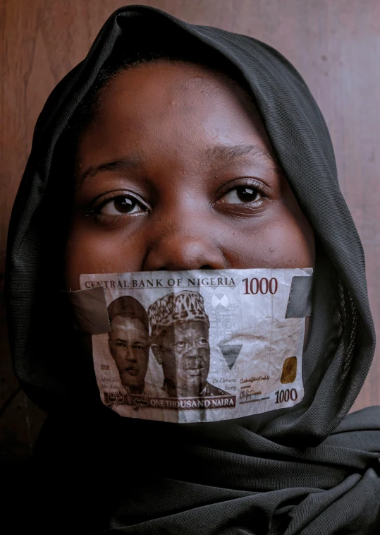 a woman with a scarf covering her face, an album cover, by Chinwe Chukwuogo-Roy, pexels contest winner, hyperrealism, banknote, islamic, wearing giant paper masks, taken in the 2000s