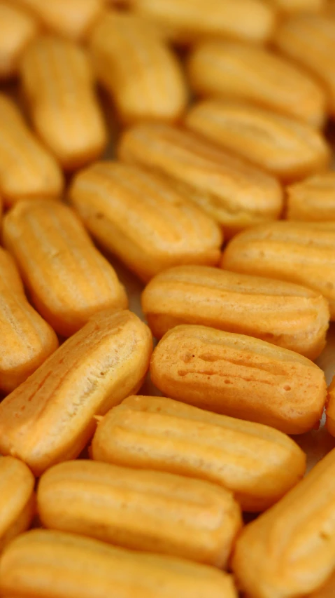 a pile of cookies sitting on top of a table, pexels, op art, orange fluffy spines, high angle close up shot, corn, square