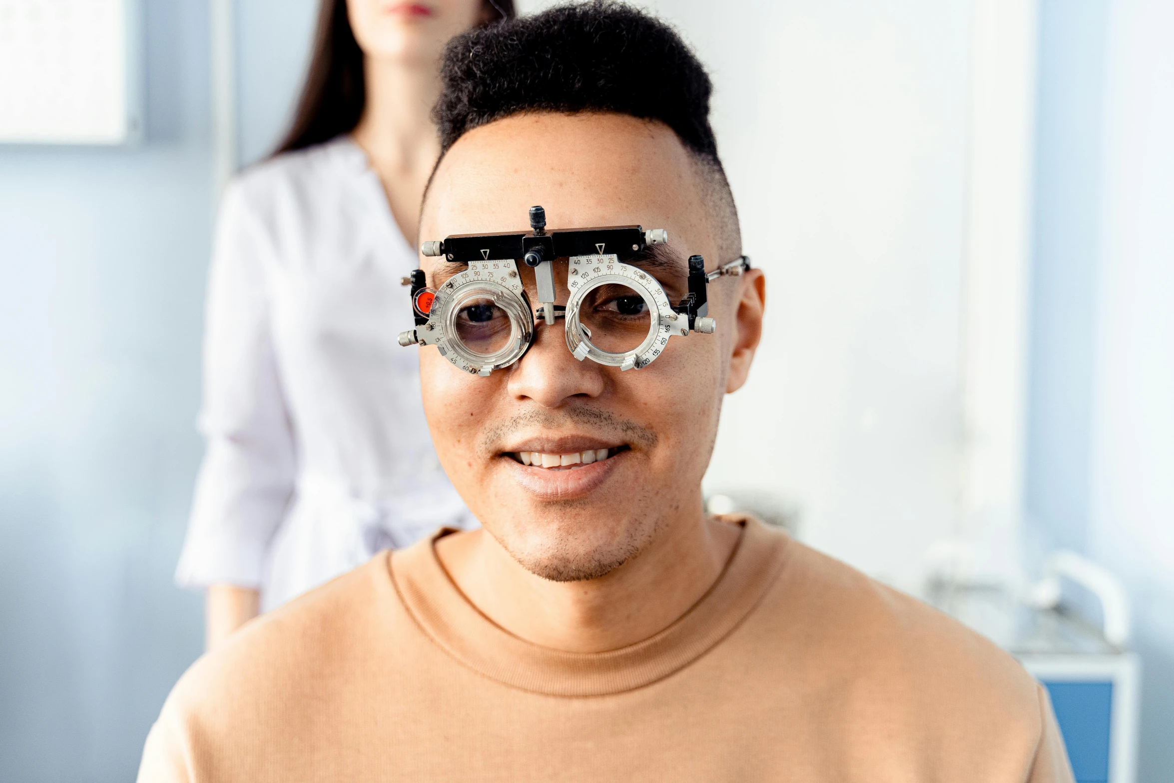a man with a pair of glasses on his face, a picture, trending on pexels, medical photography, highly mechanical, blind brown man, center of image