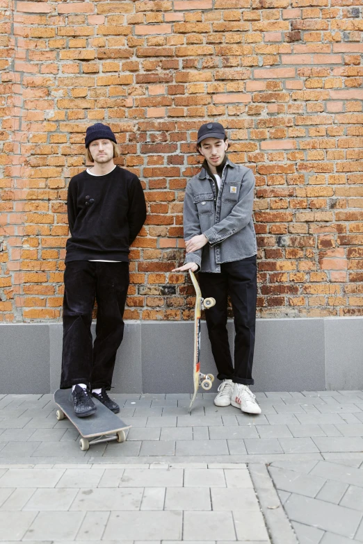 a couple of men standing next to each other with skateboards, a picture, szekely bertalan and lotz karoly, baggy clothing and hat, no - text no - logo, boyish