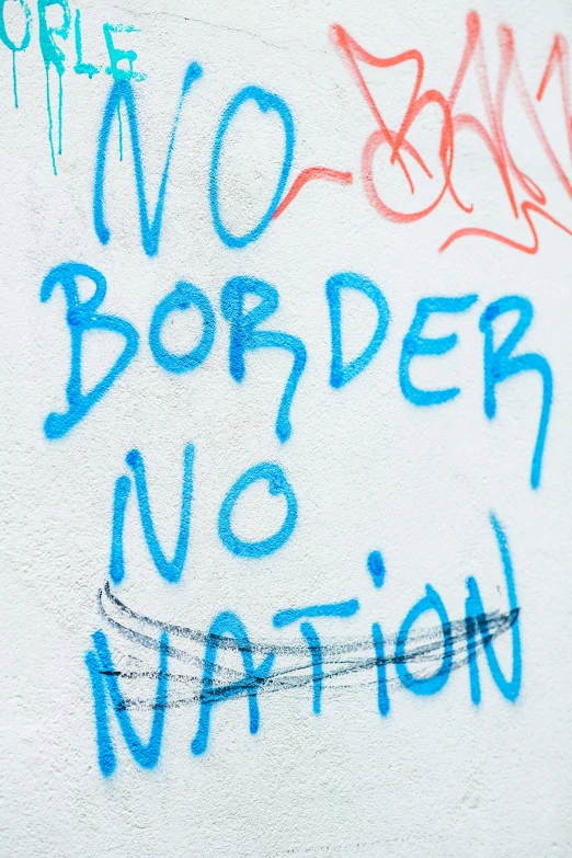 graffiti on a wall that says no border, no nation, shutterstock, bo burnham, thumbnail, mediterranean, no cropping