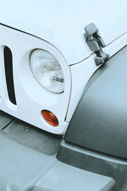 a close up of the front of a white jeep, by David Donaldson, clean and simple, headlight washer, easy to understand, profile picture