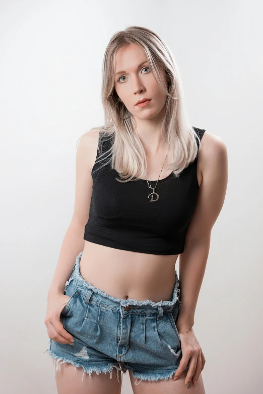 a woman standing with her hands in her pockets, an album cover, inspired by Elsa Bleda, featured on reddit, renaissance, wearing a cropped black tank top, 🤤 girl portrait, pale hair, 5 0 0 px models