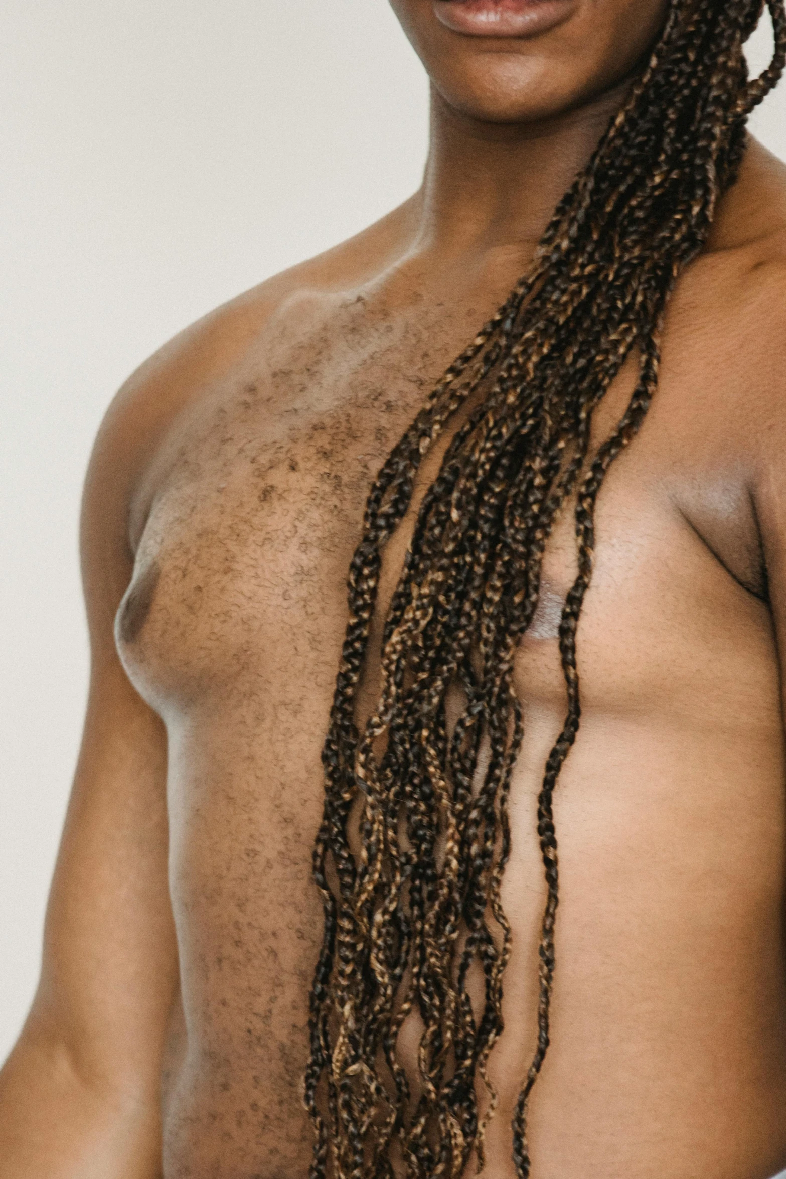 a man with dreadlocks is posing for a picture, side boob, skin texture details, light-brown skin, upper body image