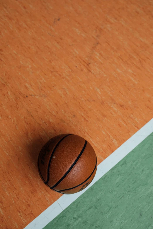 a basketball ball sitting on top of a tennis court, green and orange theme, barbara canepa, tabletop, square