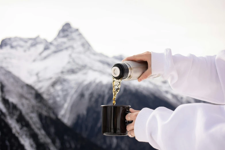 a person pouring coffee into a cup with mountains in the background, by Daniel Seghers, wearing nanotech honeycomb robe, whistler, white, flasks