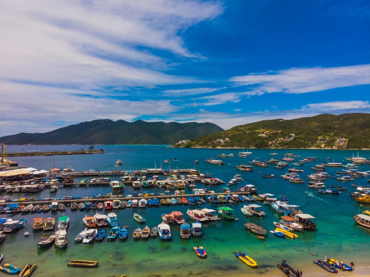 a large body of water filled with lots of boats, a photo, pexels contest winner, edu souza, fan favorite, sapphire waters below, avatar image