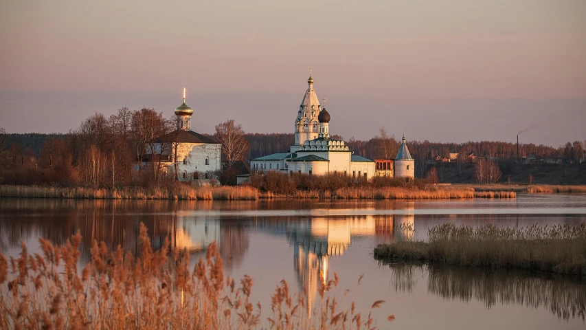 a large body of water with a church in the background, inspired by Konstantin Vasilyev, unsplash contest winner, at sunrise in springtime, portrait mode photo, marsh, orthodox icons