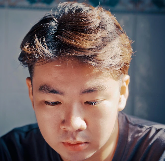 a close up of a person looking at a cell phone, an album cover, inspired by Yeong-Hao Han, unsplash, shin hanga, headshot profile picture, looking directly at the camera, slightly tanned, darren quach